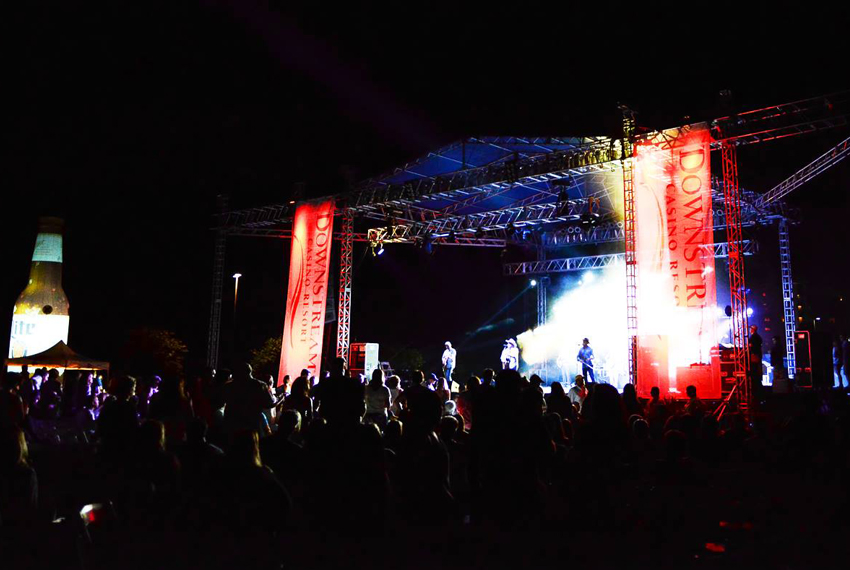 Musician playing a guitar during a live concert